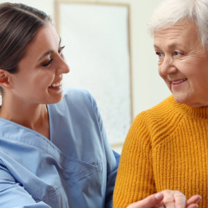 woman looking to elderly woman