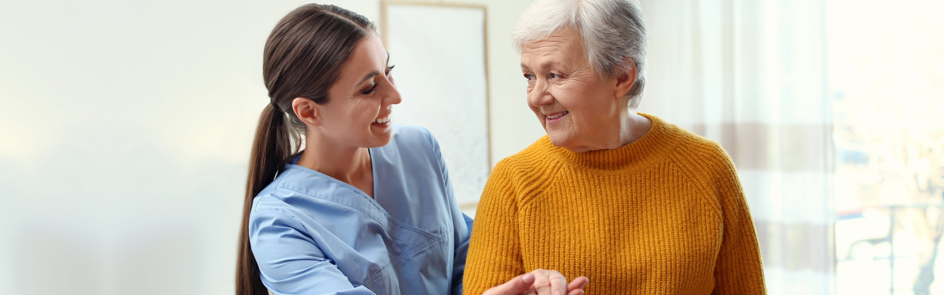 woman looking to elderly woman