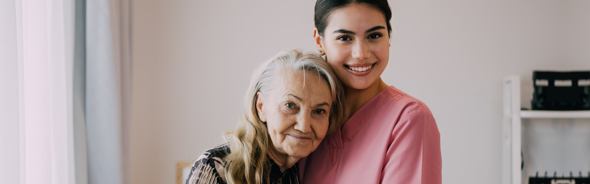 woman hug elderly woman