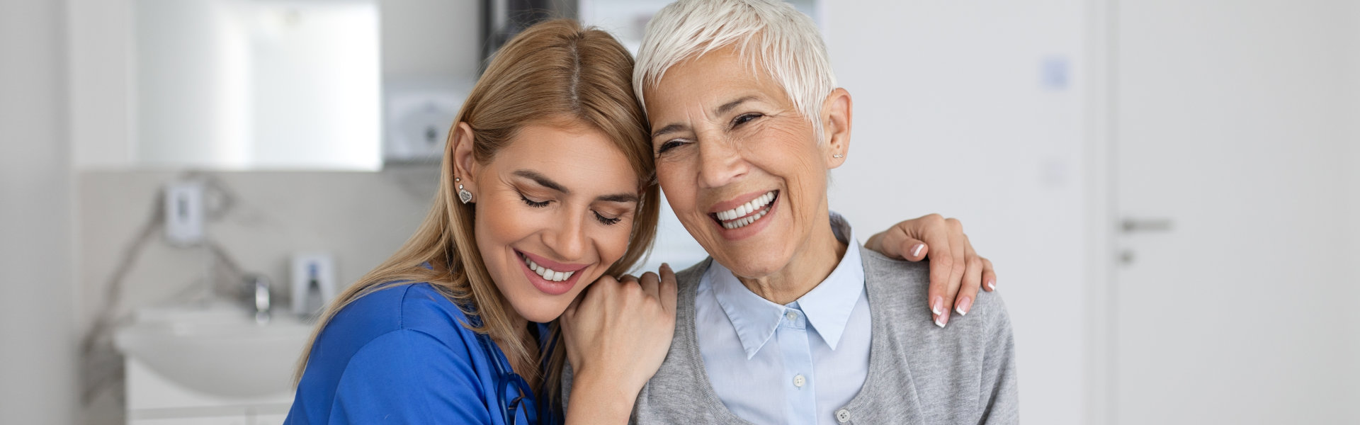 woman hug elderly woman